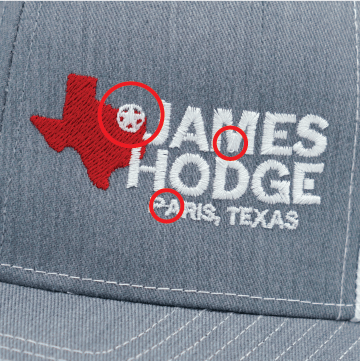 grey james hodge badgecap with 3 red circles highlighting errors in embroidery